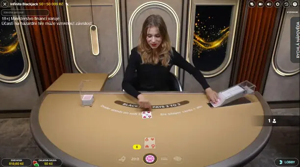 Apollo Games Infinite Blackjack – živá hra s profesionální dealerku. Krupiérka rozdává karty ve hře Infinite Blackjack v online casinu Apollo Games.